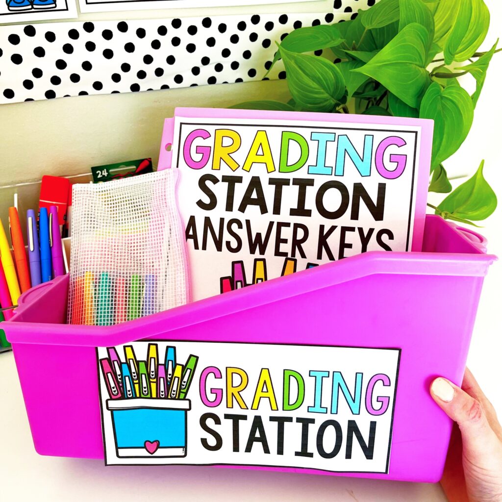 Save time by incorporating a Grading Station into your math center routine in your elementary classroom! When students complete a math center with a recording page, they can take finished work to the grading station. They get to be the “teacher” and check their own work! This is a huge time-saver for me and also helps my students to be accountable! Read more to learn about how I set-up my Grading Station Tub for math centers, how I use this as assessment, and grab the grading station freebie! 