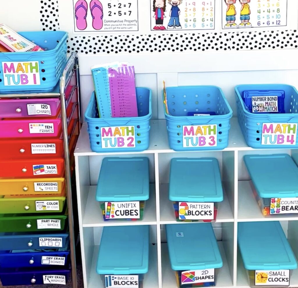 Organized 1st grade math center tubs with manipulatives and reusable math center activities