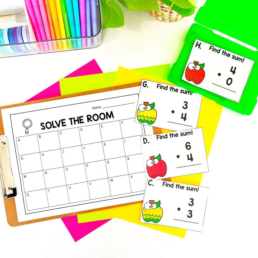 Apple Solve the Room math center for 1st grade with addition and subtraction practice.